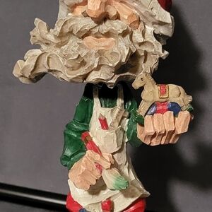 Handcrafted Santa Figurine with Rocking Horse